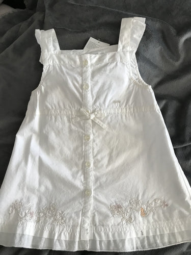White embroidered baby dress.