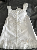 White embroidered baby dress.