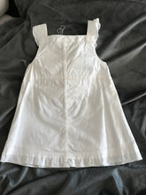 Load image into Gallery viewer, White embroidered baby dress - back view.

